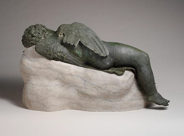 Bronze statue of Eros sleeping. Said to have been found on Rhodes - Greece (Richter 1943-44, p. 122) [1930, purchased by Joseph Brummer from E. Geladakis, Paris]; acquired in 1943 - Jacob S. Rogers Fund Period: Hellenistic period - Date: 3rd–2nd century B.C. -  Culture: Greek Medium: Bronze - Dimensions:16 1/2 × 14 × 33 9/16 in., 275 lb. (41.9 × 35.6 × 85.2 cm, 124.7 kg) Height (w/ base): 18 in. (45.7 cm) Classification: Bronzes - Credit Line: Rogers Fund, 1943  Accession Number: 43.11.4 http://www.metmuseum.org/art/collection/search/254502